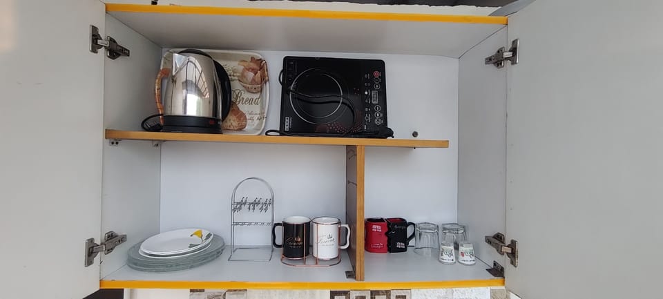 Mini kitchen with basic amenities, No fire cooking.