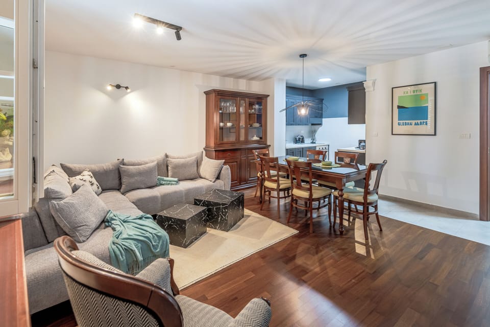 Deluxe Apartment, City View | Living area | 150-cm flat-screen TV with cable channels