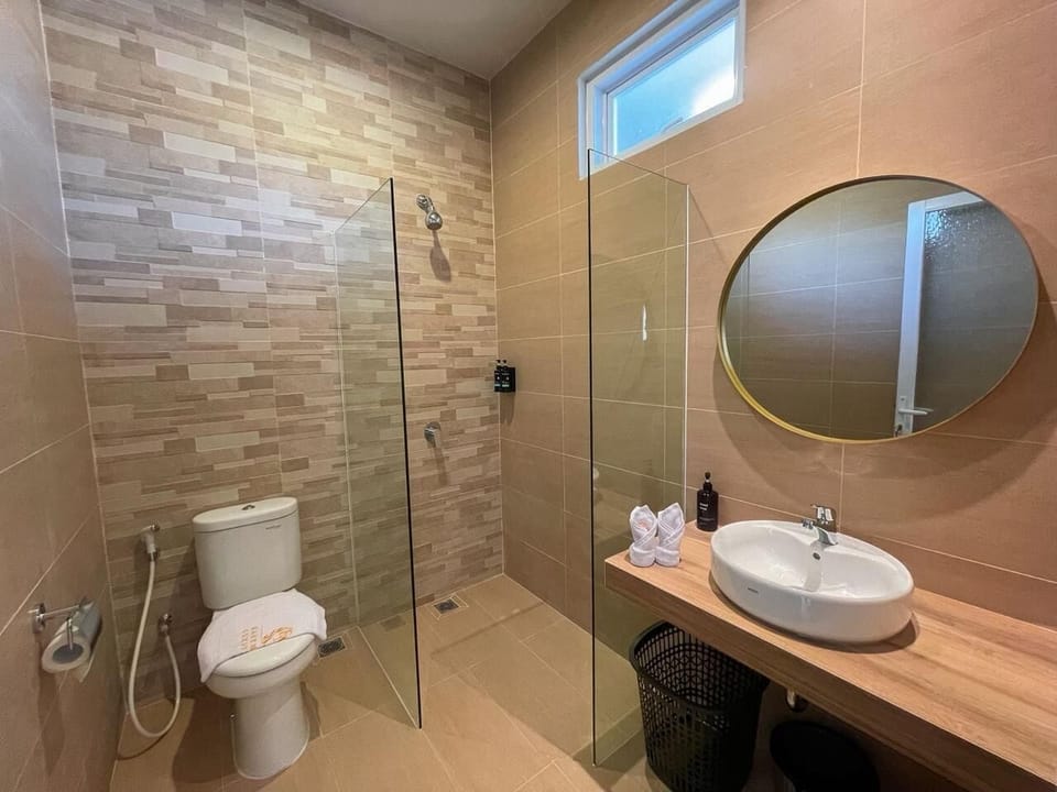 Shower, hair dryer, slippers, towels