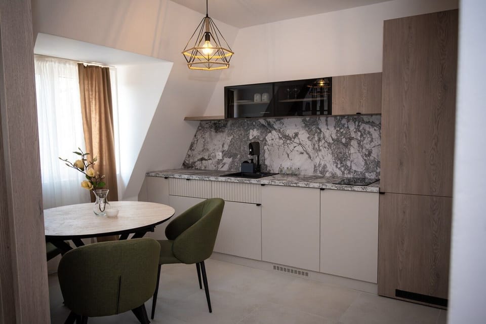 Luxury Apartment, Balcony | Living area | 50-inch LCD TV with cable channels, heated floors