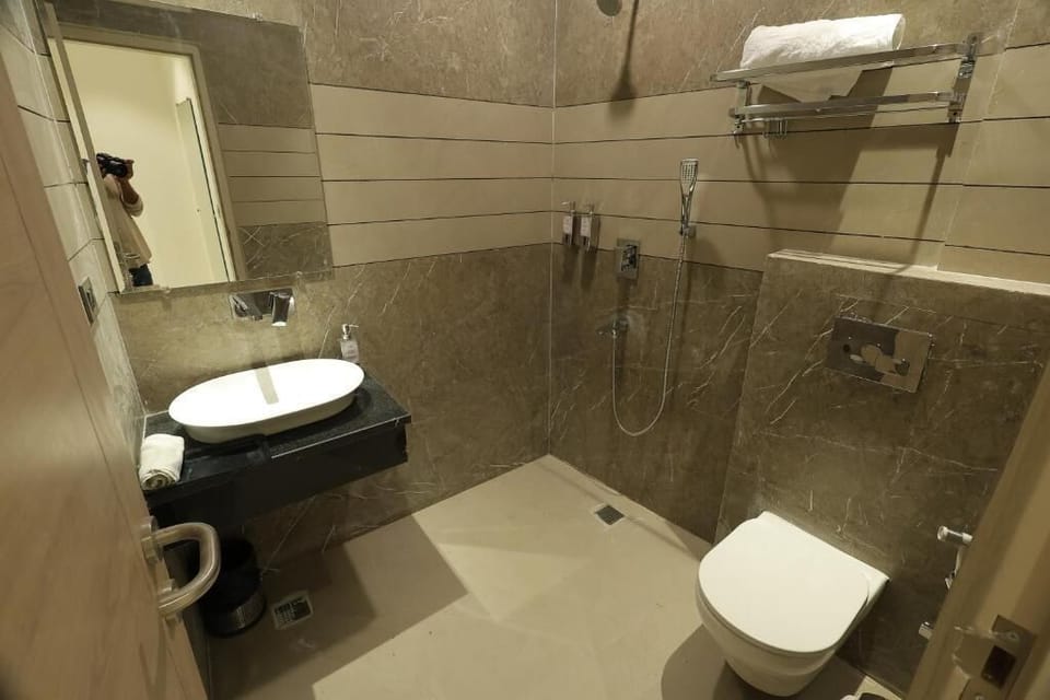 Shower, slippers, towels, soap