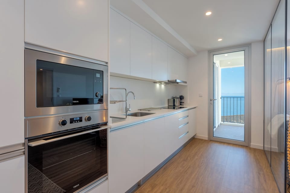 Apartment, Balcony, Ocean View | Private kitchen | Full-size fridge, microwave, oven, stovetop