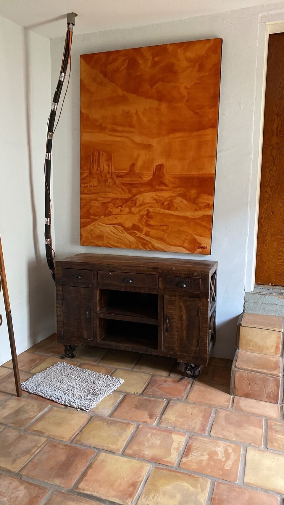 Breakfast bar in the breakfast room under a large painting by Muralist DMNGO