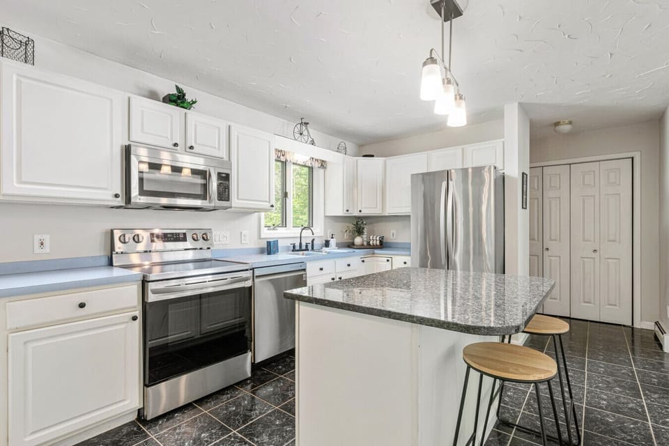 Brew your morning coffee or whip up a feast in this stylish, modern kitchen.