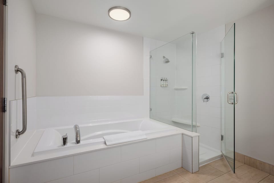 Suite, 1 King Bed with Sofa bed, Jetted Tub | In-room safe, desk, laptop workspace, blackout drapes