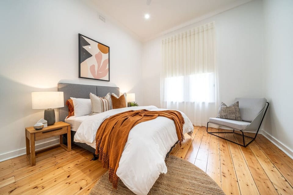 Settle into the second bedroom with a queen bed and a calm, comfortable feel.
