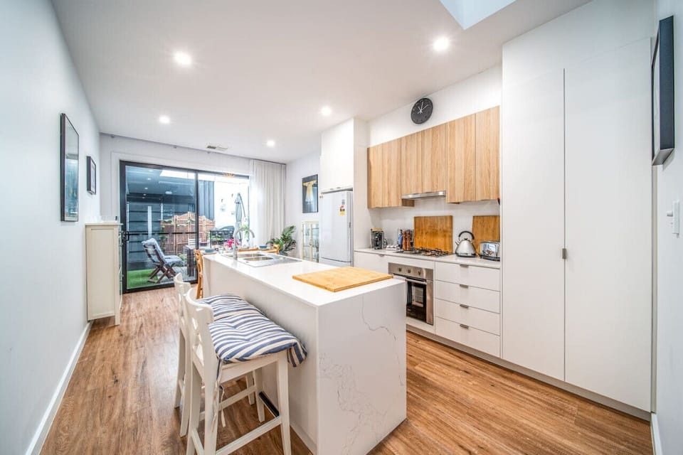 A streamlined kitchen design creates a practical and inviting space for everyday cooking.