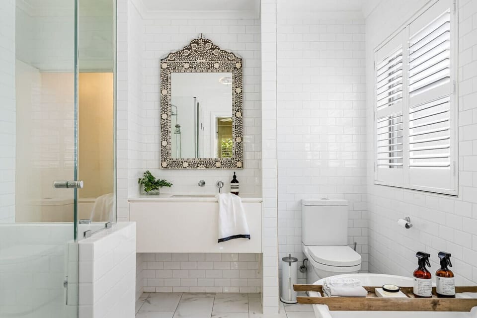 Refresh in a bright, elegant ensuite of the main bedroom designed for a calm start or end to your day.