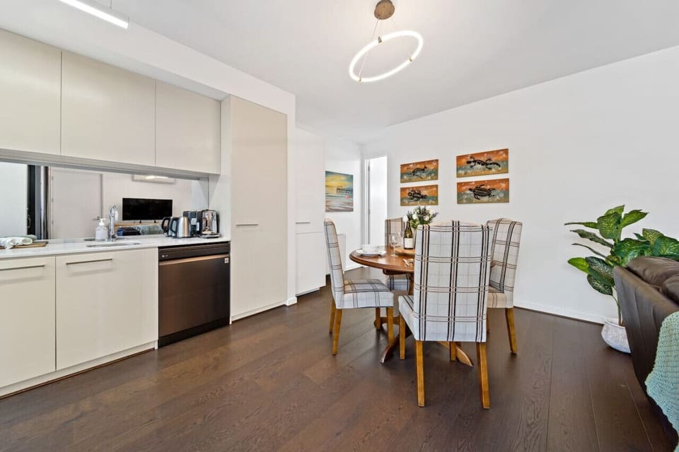 Comfortable four-seater dining space for shared meals, morning coffee, or a quiet place to work.