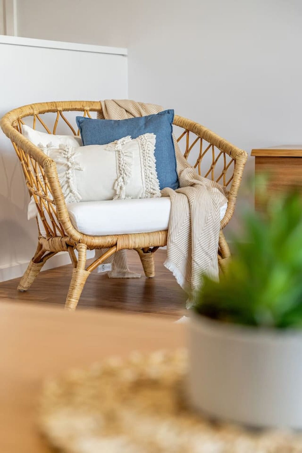 Woven textures, stylish furniture, and coastal touches make this the ultimate getaway lounge.