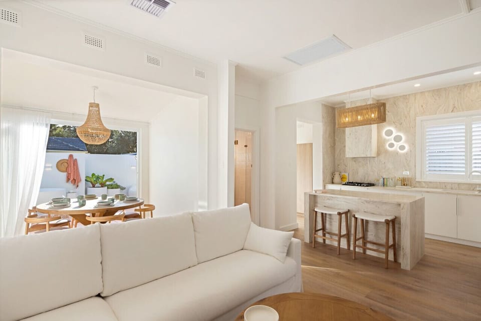 Relax in the open-plan living area where soft tones and natural light create a calm retreat.