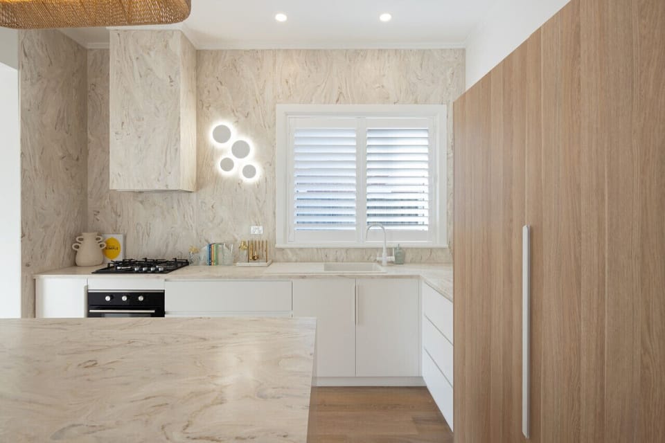 Enjoy ample bench space and cabinetry, ideal for preparing meals with ease.