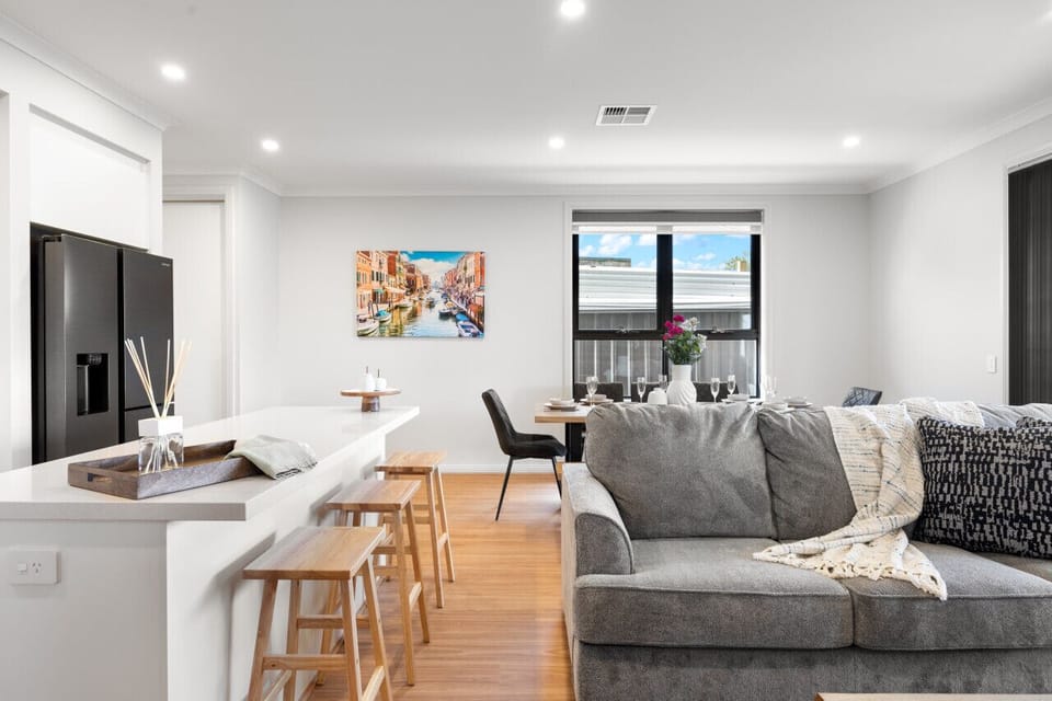 Light-filled interiors and warm timber accents bring a relaxed and welcoming feel to every corner of the home.