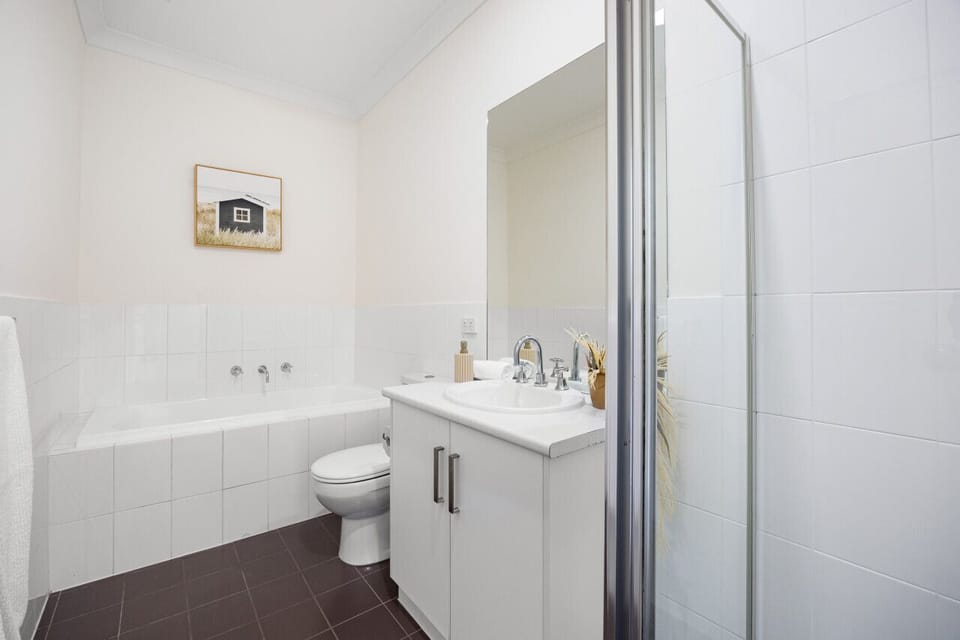 A clean contemporary bathroom equipped with everything you need for a comfortable stay.
