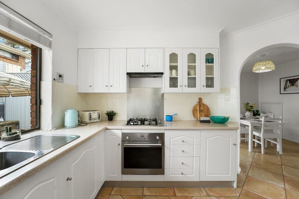 Prepare meals with ease in the bright kitchen, where generous bench space makes everything from morning coffee to evening cooking simple.