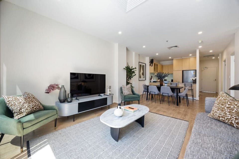 Open and airy, this modern living and dining space exudes sophistication with cosy touches..