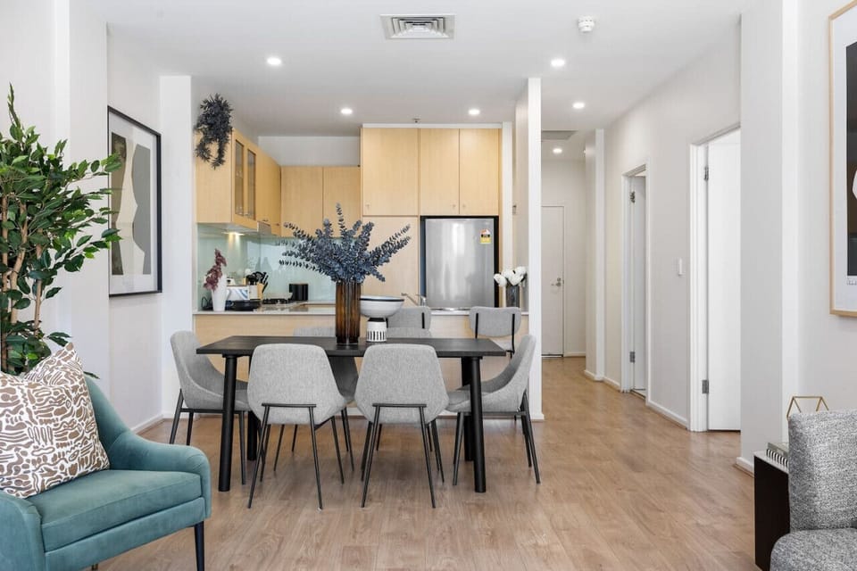 This open-concept dining and kitchen area blends sophistication with comfort.