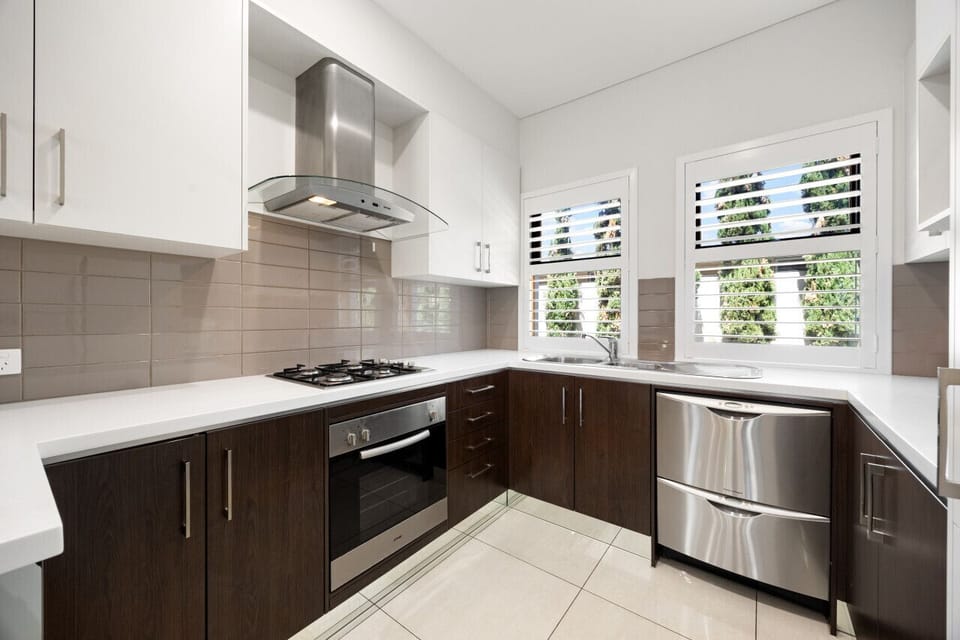Cook up a storm in the sleek kitchen equipped with stainless steel appliances and ample natural light.
