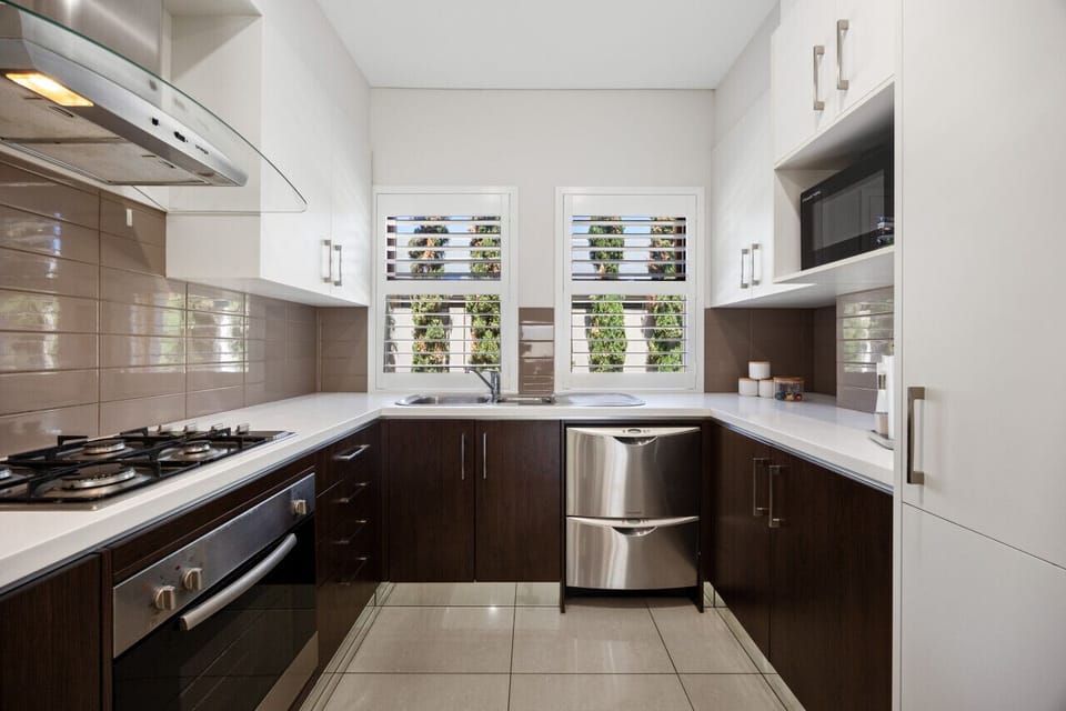 A modern kitchen with top-of-the-line appliances and a clean, minimalist design.