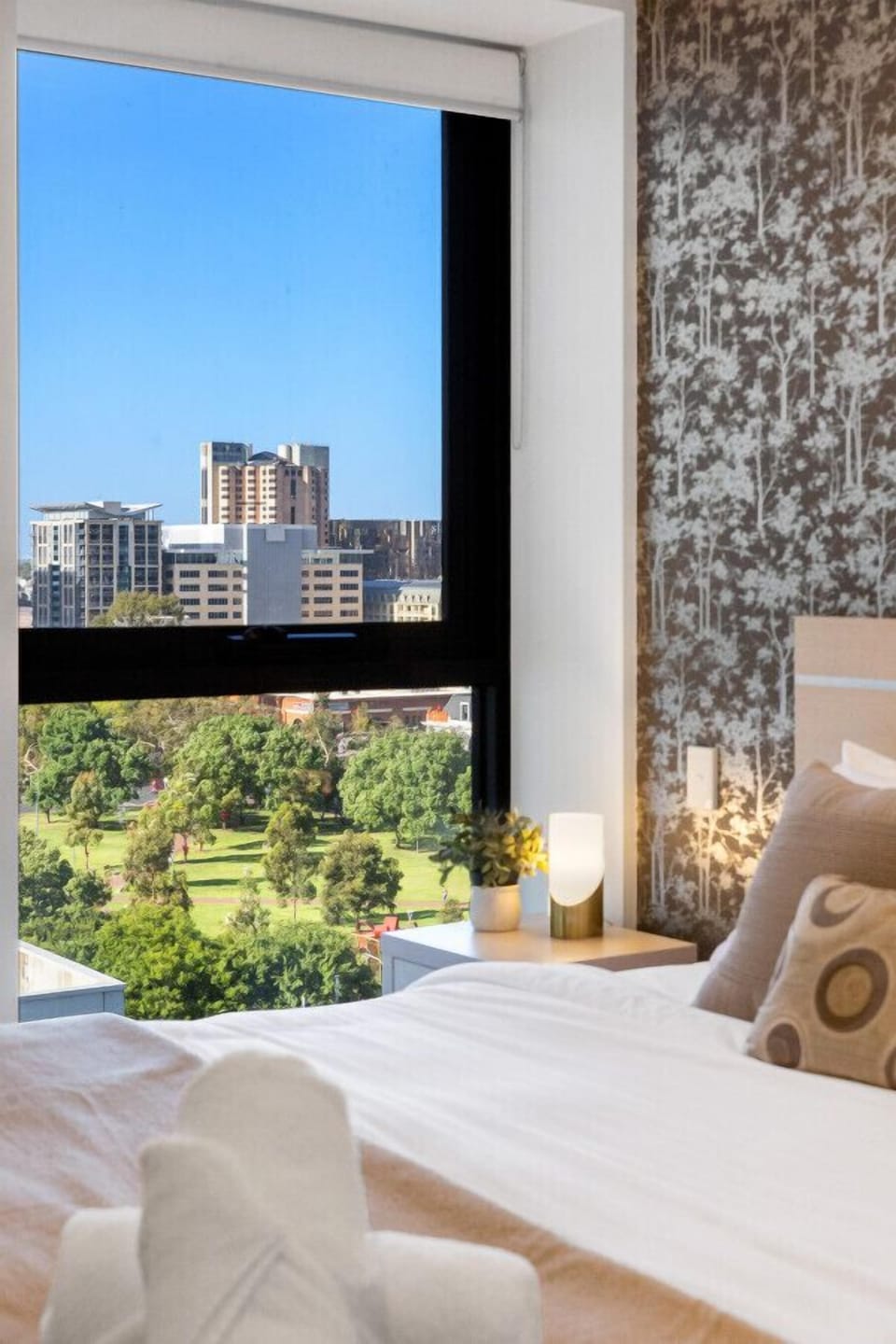 Wake up to serene parkland views and urban charm.