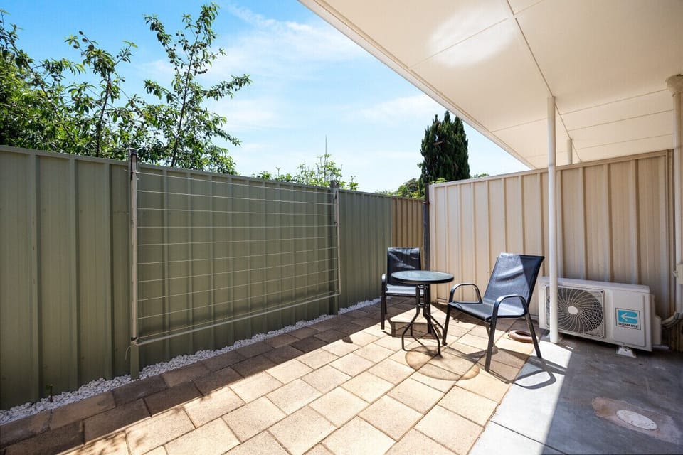 Enjoy quiet moments outdoors in the private courtyard, with a cosy table setting perfect for morning coffee or evening drinks in the fresh air.