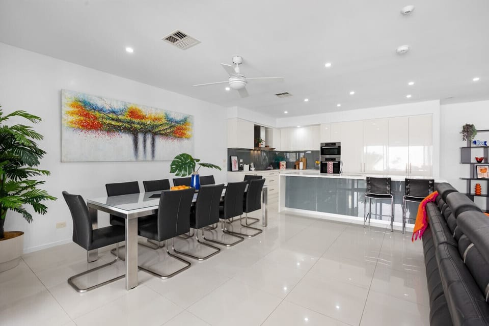 Open layout flows from kitchen to dining, keeping everyone in the mix.