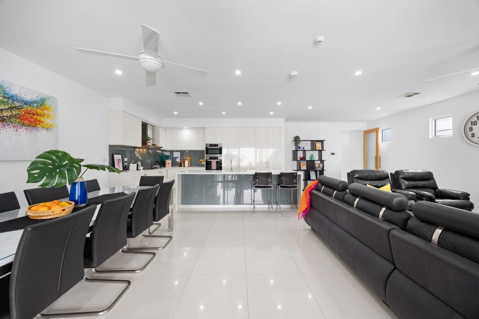 Zoomed-out dining-to-living transition — because life happens somewhere between a shared meal.