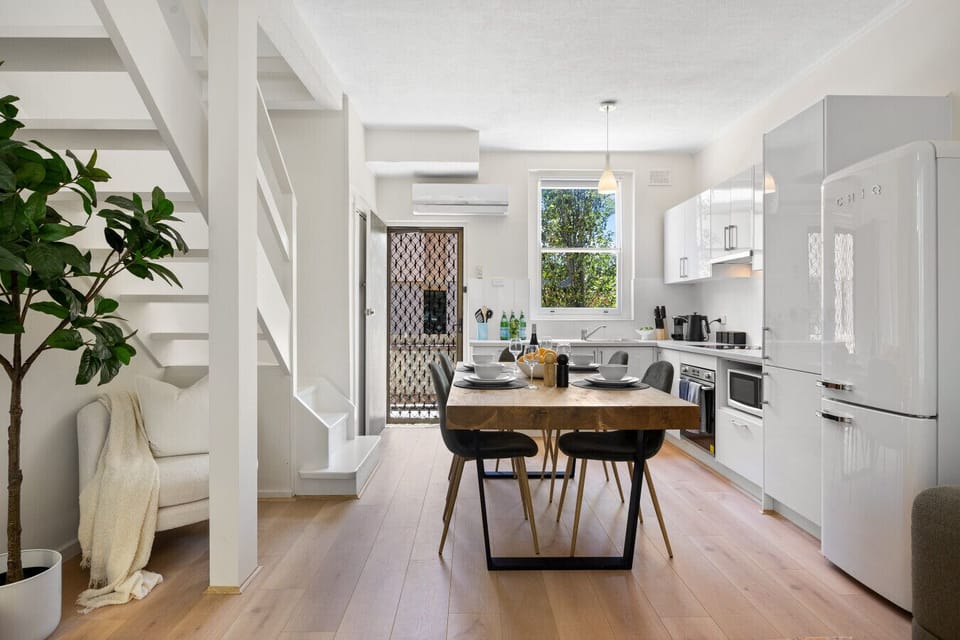 Gather around the dining table to share meals or plan a day exploring Henley Beach and the nearby foreshore.