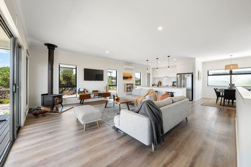 A light-filled open-plan layout seamlessly connecting the living, kitchen and dining areas—perfect for easy, social living.
