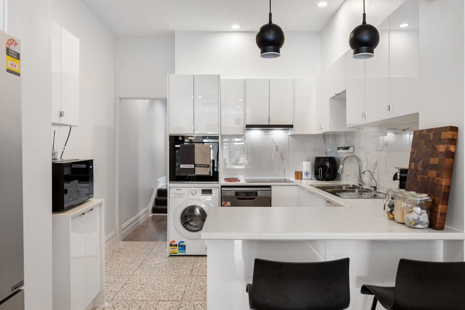 Pull up a seat at the breakfast bar, a casual spot for morning coffee or a quick bite before heading out.