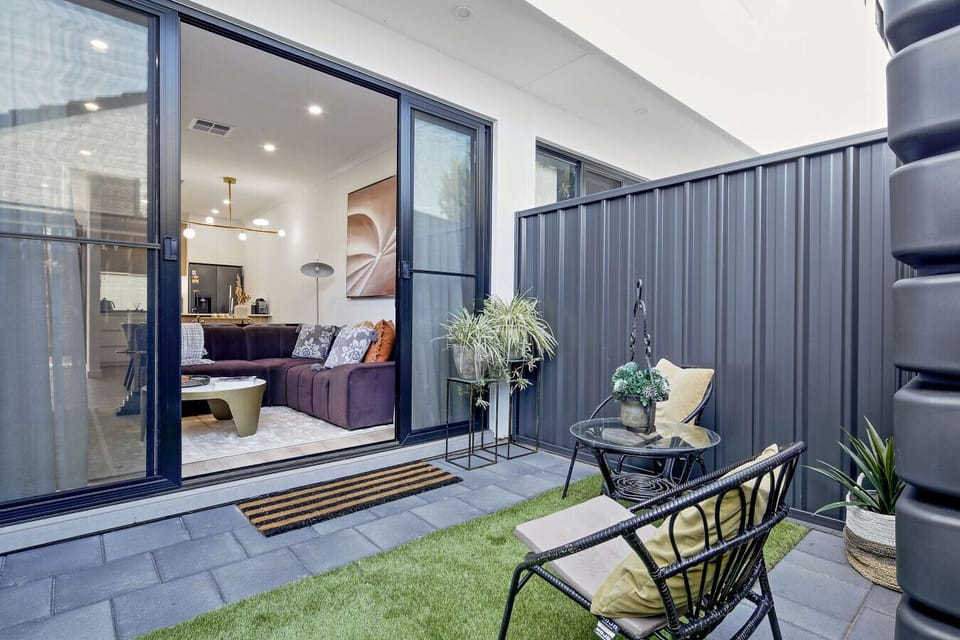 Slide open the doors to this private courtyard, perfect for an afternoon chat or a quiet read.