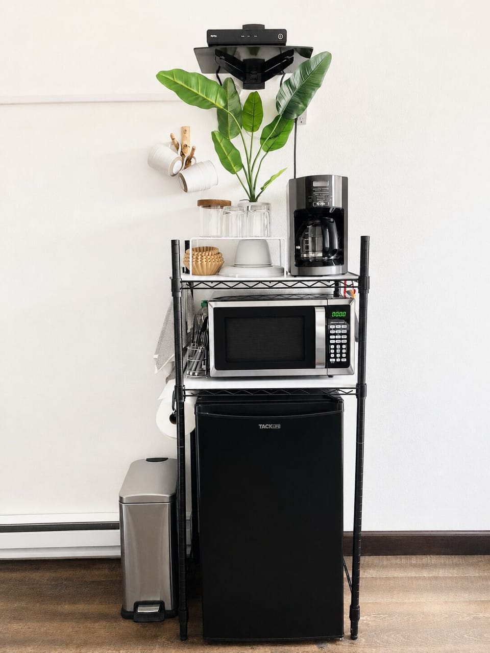 Coffee maker, mini-fridge, microwave, dishes, glassware, utensils