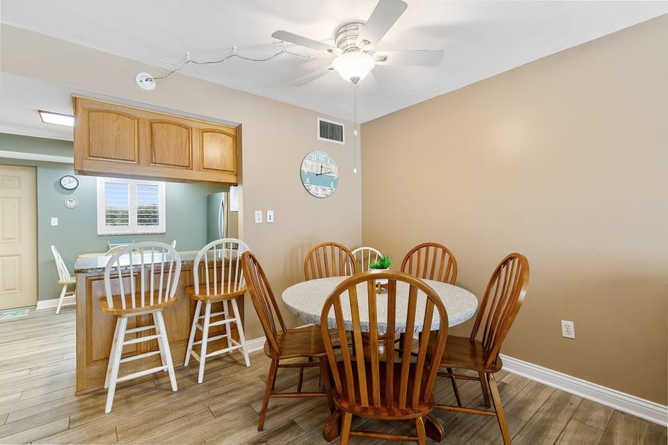 Gather for beach-day meals in this comfortable dining area, complete with seating for everyone and easy access to the kitchen—perfect for relaxed coastal living during your stay.