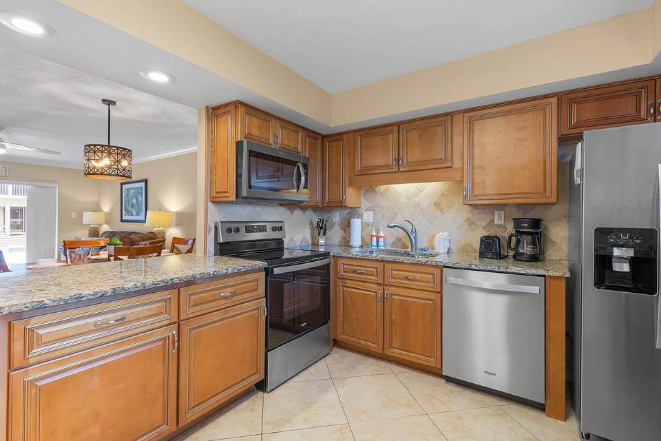 Cook your favorite beach-day meals in this fully equipped kitchen, featuring modern appliances and plenty of counter space for your ocean-side stay.