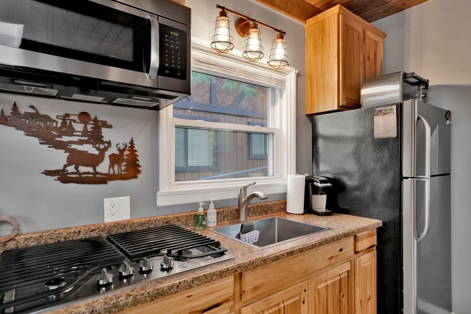 Spacious kitchen featuring clean design, ample storage, and natural light.