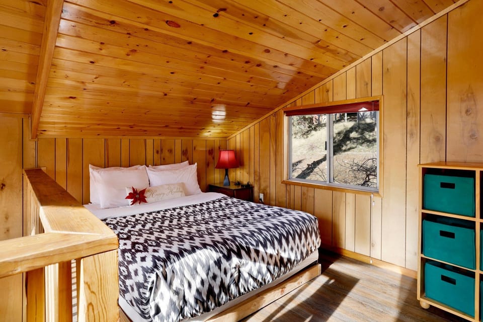 This open loft area features a queen-size bed, creating a cozy and flexible sleeping space for guests.