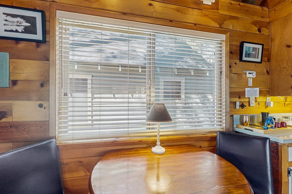 Gather around the dining table, which offers seating for four perfect for meals and game nights.