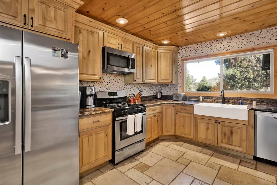 This fully stocked kitchen includes modern appliances, generous counter space, and everything needed to prepare meals during your mountain getaway.