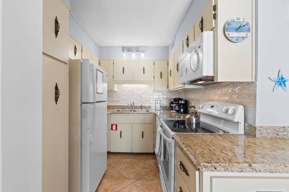 Fully stocked kitchen with brand new backsplash