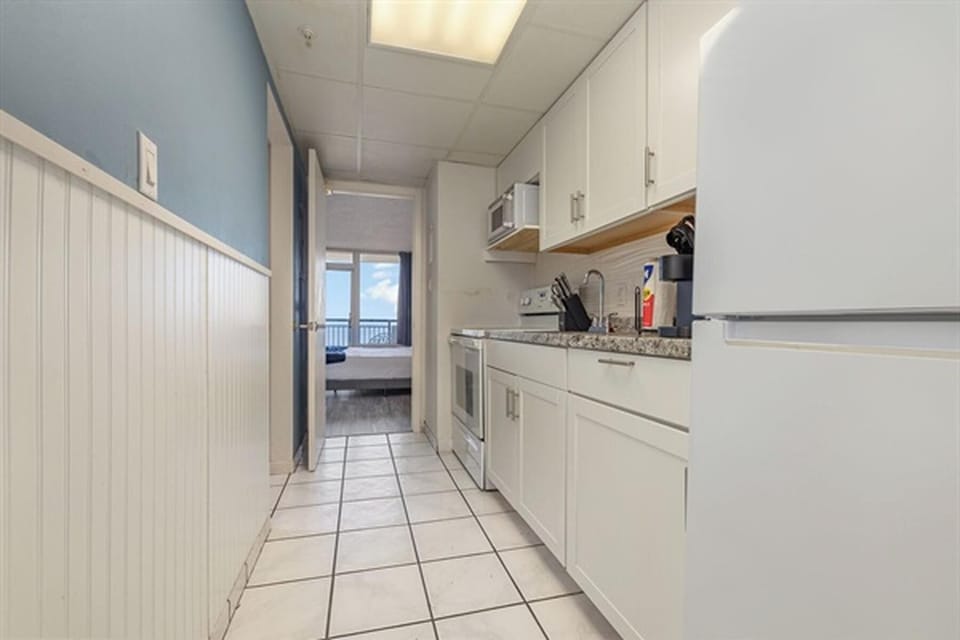 Fully equipped galley kitchen with modern appliances