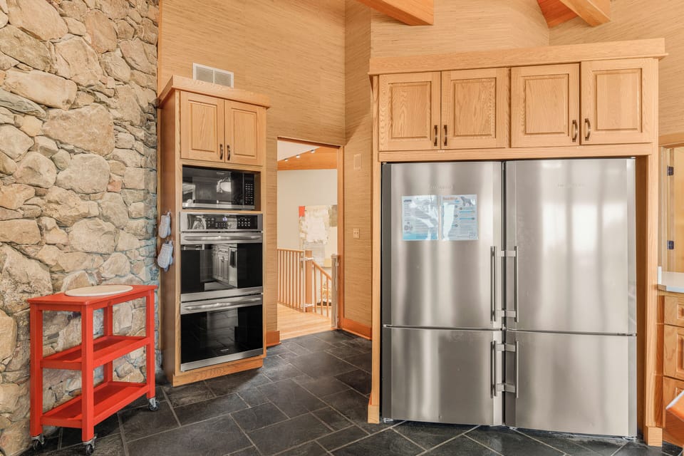 Two full size refrigerators (side by side), 2 ovens, microwave
