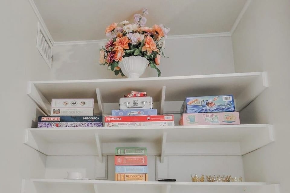 An assortment of games awaits to entertain the ton—classics like Clue and Monopoly with a Bridgerton flair, perfect for laughter, rivalry, and a little lighthearted scheming after tea.