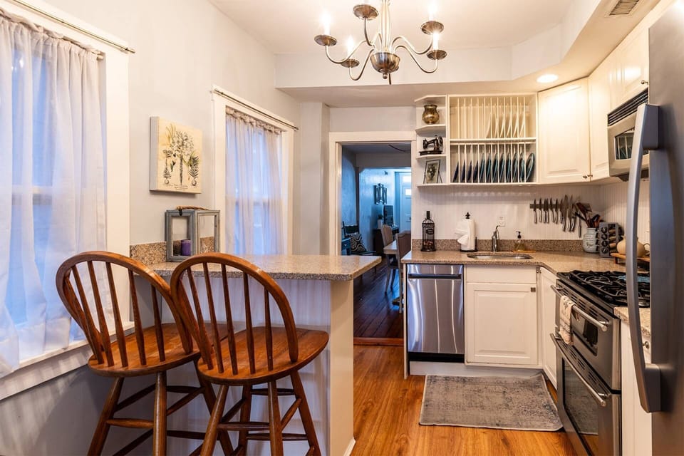 The home's historic charms is blended with all of the modern updates, like the full kitchen's finishes and appliances.