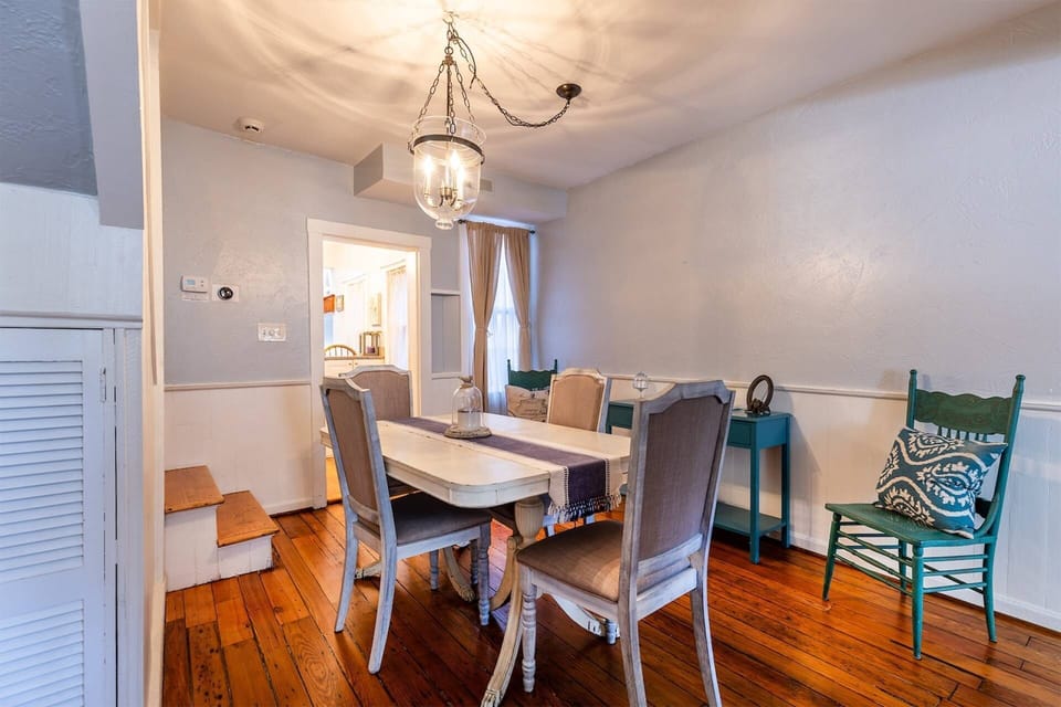 The dining room table seats up to 6 guests.
