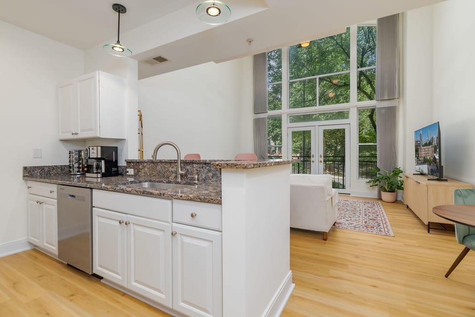 Bright and airy kitchen with sleek appliances and delightful views!
