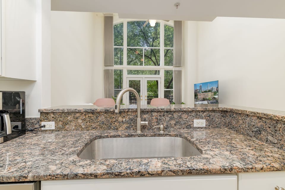 Bright and modern space with sleek granite counters.