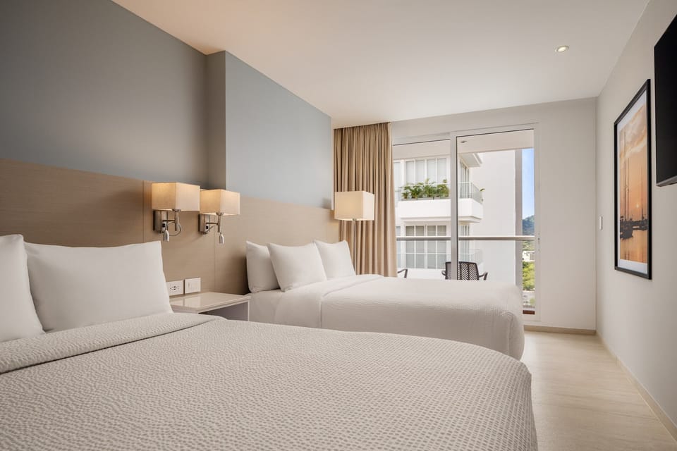 Room, 2 Double Beds | Down comforters, minibar, in-room safe, desk