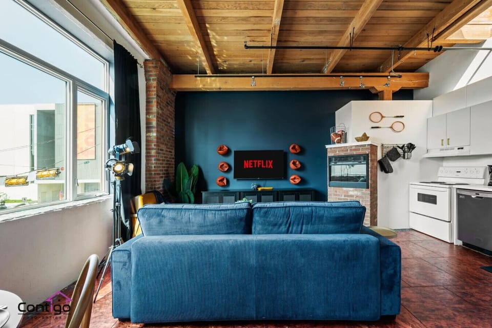 Kick back on the plush sofa and enjoy a movie night with Netflix and a touch of vintage sports charm.