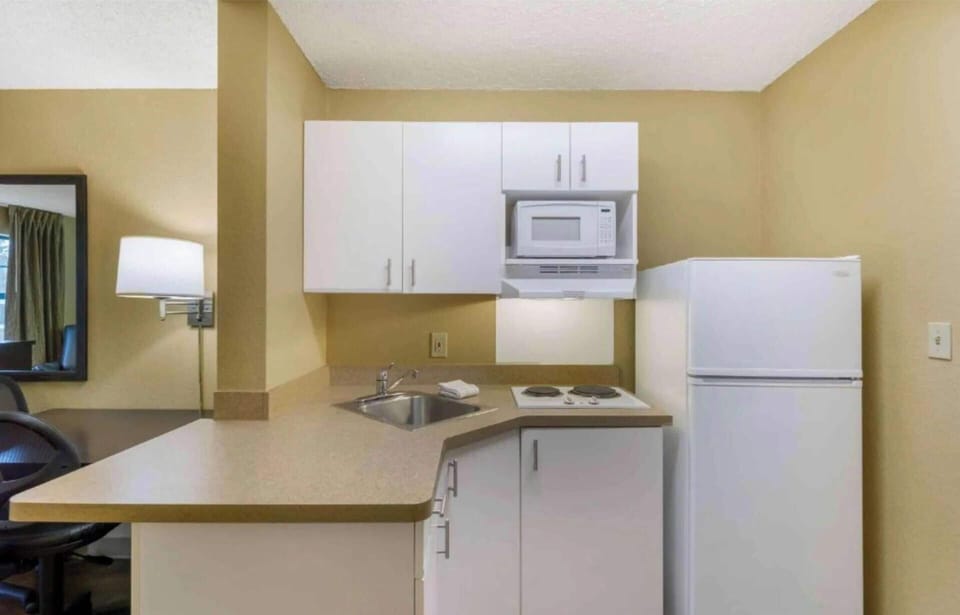 Fridge, microwave, stovetop, coffee/tea maker
