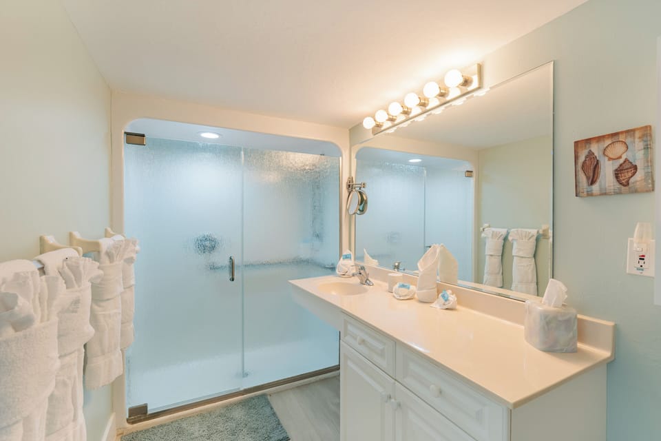 Bathroom featuring a spacious walk-in shower.